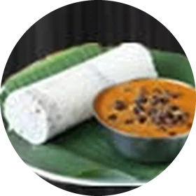 Puttu with kadala curry on a banana leaf